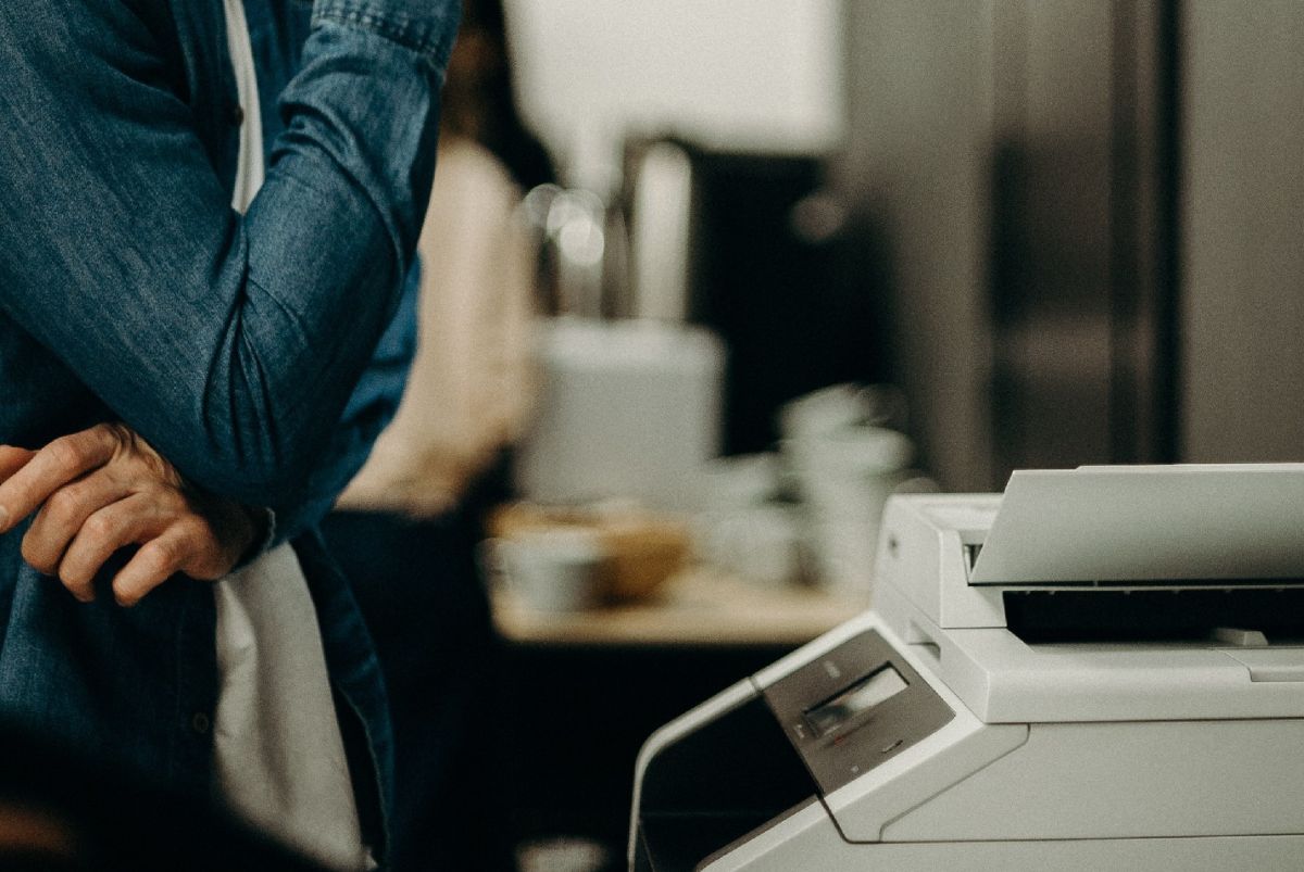 man-using-a-printer