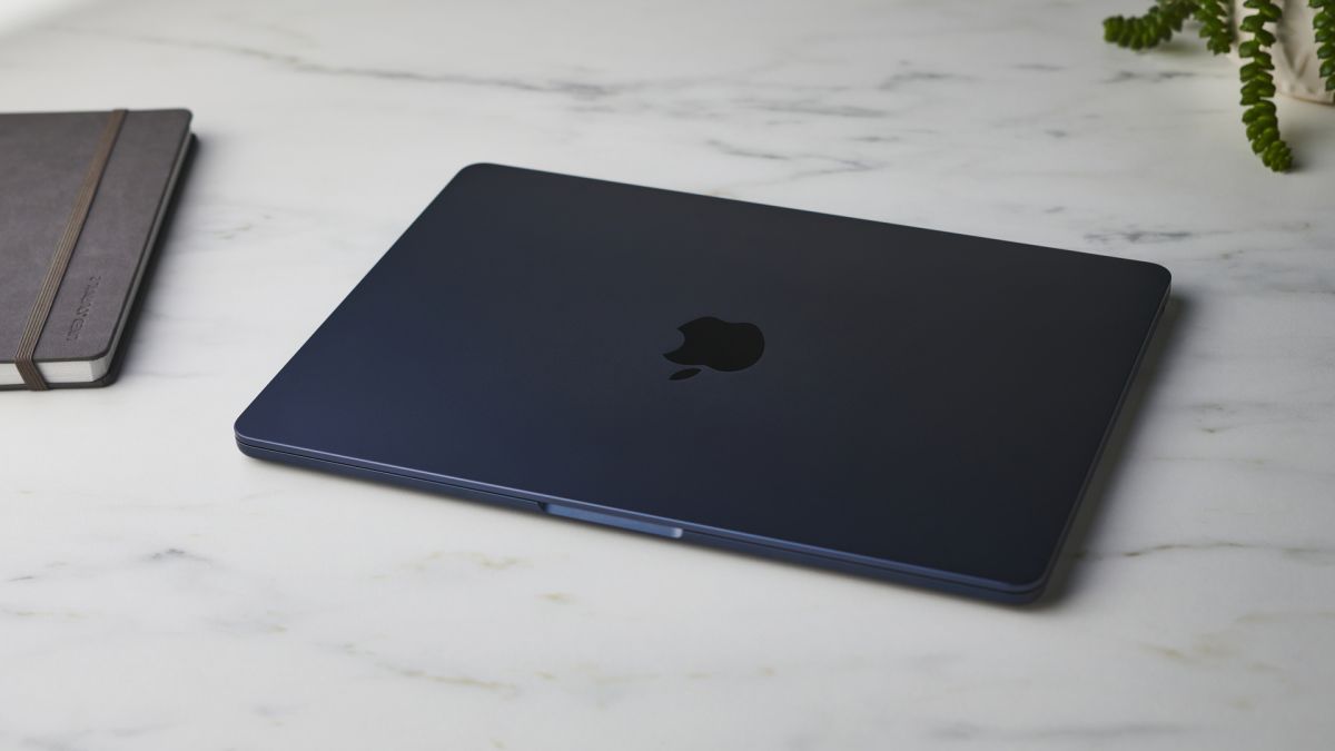 Apple MacBook Air (M2, 2022) on a white desk in a studio