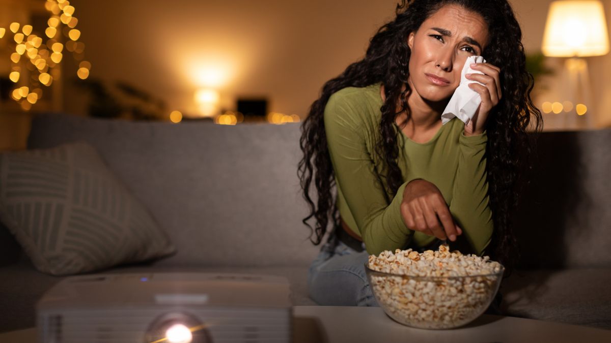 Woman Crying Watching Sad Movie On A Projector