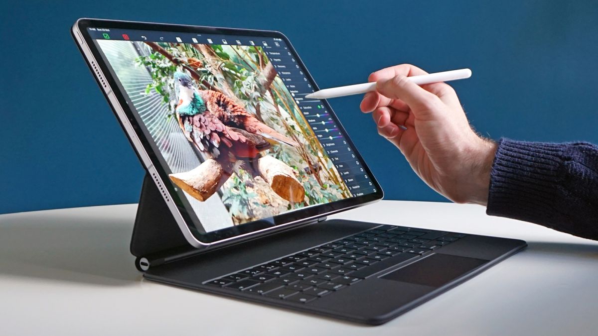 The iPad Pro 12.9 (2022) being used with a Magic Keyboard and Apple Pencil