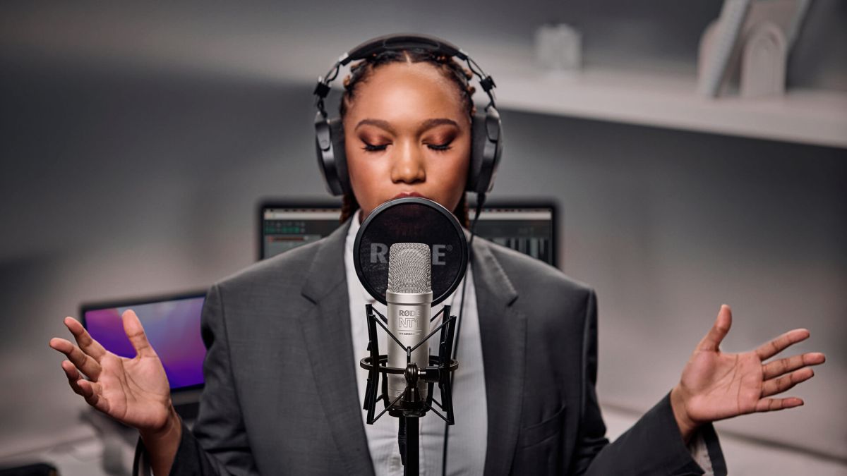 woman singing into RODE NT1 microphone