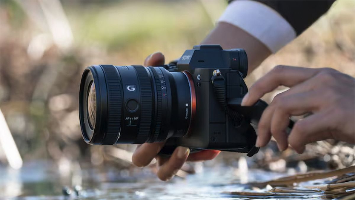 Sony FE 16-25mm F2.8 G lens outdoors in the hand